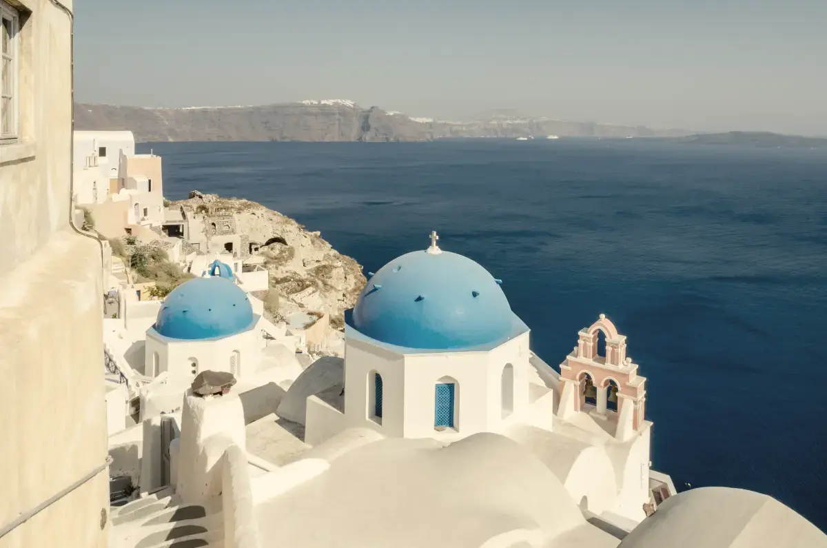 Blue-domed churches of Oia overlooking the Santorini caldera